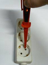 Non contact voltage testers work by detecting the changing electric field around objects conducting an ac current (ac stands for alternating current). Test Light Wikipedia