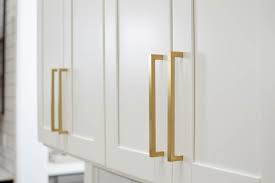 Modern Gold Handles Are A Stunning Accent To The White Cabinets Condo Decorating House Design Gold Handles