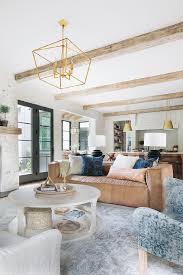 This matches with the various wooden elements of the great room like the railings and the base of the fish tank. Living Room Rustic Wood Ceiling Beams Design Ideas
