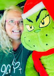 Man gives child plushy at parade