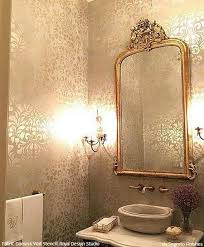 Look to warm and cozy taupe wall paint to pair with light greens, pinks, and blues, such as with this room's shower curtain and artwork. Wall Stencils The Secret To Remodeling Your Bathroom On A Budget Royal Design Studio Stencils