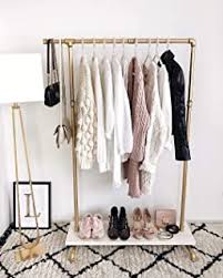 Clothes racks and organizers arrange your clothes on poles or in compartments so you can quickly and easily grab what you want to wear. Amazon Com Gold Garment Racks Clothing Closet Storage Home Kitchen