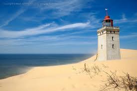 Construction Of The Now Abandoned Rubjerg Knude Lighthouse In Jutland Denmark Straddled The Last Two Centuries Begi Beautiful Lighthouse Lighthouse Abandoned