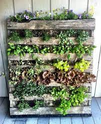 Next, roll out landscape fabric approximately twice the length of the pallet you are using and then cut the fabric in half down the middle with scissors or a razor blade. Angie S List Herb Garden Pallet Vertical Herb Garden Pallet Garden