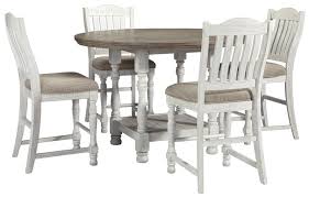 Wyndahl counter height dining table and 4 barstools set. Millennium Havalance 392381439 Round Dining Room Counter Height Table And 4 Upholstered Barstools Set Sam Levitz Furniture Dining 5 Piece Sets