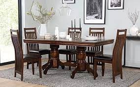 Dining room furniture is available in many types of wood and other materials and it is possible to purchase furniture dining sets that are made from sustainable wood sources. Chatsworth Dark Wood Extending Dining Table With 6 Java Chairs Brown Leather Seat Pads Furniture And Choice