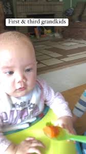 Feeding my first granddaughter with my homemade baby food.