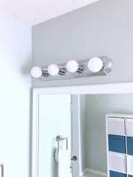 Give your bathroom an industrial farmhouse look on a budget. Update Your Light Fixtures No Electrician Required