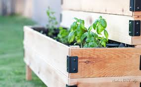 I thought this would be the perfect spot to add the diy tiered herb garden along with a kind of raised bed along the remaining length of the desk just to clean it all up, add some color to the yard, and grow some great herbs and vegetables! Diy Tiered Raised Garden Bed Anika S Diy Life