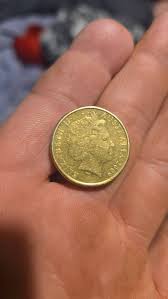 Hello everyone think I've found something Got a 2009 $1 coin 1 little  section it is silver and not gold and the front is very rough any thoughts 