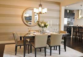 While the soft stripes here are wallpaper, you could achieve the same effect with crackle glaze and paint. 15 Dazzling Dining Room Designs With Striped Walls