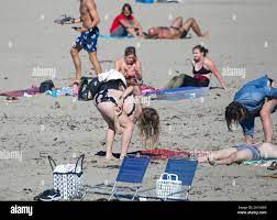 Girl in Bikini Practicing Twister game Stock Photo - Alamy
