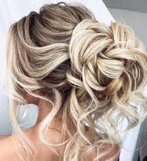 Get The Look This Pulled Back Hairstyle Features Loose Curls Braids Pulled Back Into A Bun Great Messy Hair Updo Bridal Hair Inspiration Long Hair Styles