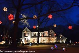 Other communities boast collections of gothic revival or italianate homes. Victorian Home Lit Up For Christmas Between Naps On The Porch