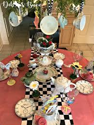 A dormouse was sitting between them, fast asleep, and the other two were using it as a cushion, resting their elbows on it, and talking over its head.very uncomfortable for the dormouse, thought alice; Alice In Wonderland Table And Party Favors Debbee S Buzz