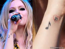 Music tattoos evoke your love for music, and are insanely cute. Avril Lavigne Music Notes Wrist Tattoo Steal Her Style