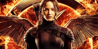 A young woman kisses a panicking young man on the lips and she says, stay with me (to get focused). 7 Things Parents Should Know About The Hunger Games Mockingjay Part 1 Geekdad