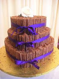 The beauty of a white wedding cake is the many ways in which it can be dressed up with traditional or modern elements. Chocolate Flake Heart Shaped Wedding Cake Chocolate Wedding Cake Cake Cheap Wedding Cakes