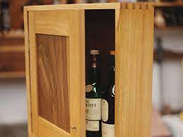 I was hired to make a companion whiskey cabinet by a repeat customer. Project Dovetailed Whiskey Cabinet Woodworking Blog Videos Plans How To