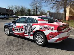 Robertson County Sheriff S Office Expands Fleet With Patriotic Car Wraps 12 Point Signworks Us Police Car Car Wrap Unique Cars