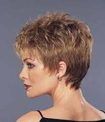 A choppy bob with lots of blonde highlights over dark roots is a classic way to wear your short, wavy hair. Pin On Mary