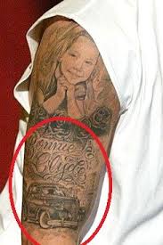 / rot in pieces / left arm: Eminem S 9 Tattoos Their Meanings Body Art Guru