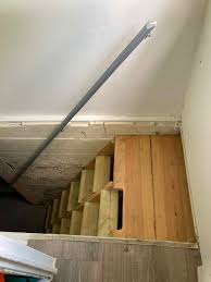 Moving basement stairs anyone have any idea what could be involved in moving our current stair well into our basement from it's present location to along the wall of the basement? Safety Of Steep Basement Stairs