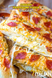 Cheesy Pepperoni Pizza Breadsticks Recipe A Tender Pizza Dough Loaded With Ooey Gooey Cheese And Topped With Pizza Recipes Homemade Pepperoni Recipes Recipes