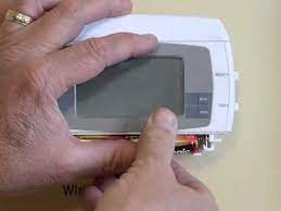 Replace the old batteries with 4 new aa batteries. Replacing 2gig Wireless Thermostat Batteries Youtube