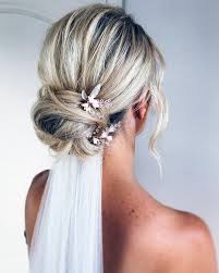 Bridal hairstyle high bun with bangs, veil and tiara. 42 Different Wedding Hairstyles With Veil Wedding Forward