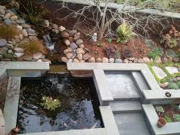koi pond with bluestone in a small hillside garden hillside garden koi pond bluestone