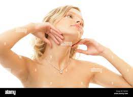 Young neked woman touching neck Stock Photo - Alamy