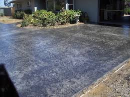 Gray concrete driveway with gray color ashlar stamped concrete borders. Stamped Concrete Gray Black Roman Slate Stamped Concrete Concrete Patio Concrete Decor Slate Stamped Concrete Patio