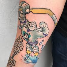 Nowadays they are a popular tattoo design: 115 Cool Ice Hockey Tattoo Designs Body Art Guru