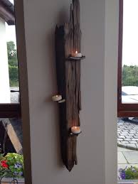 Mostly the candles are just part of the decoration. Driftwood Candle Rustic Home Interiors Wall Candle Holders Wall Candles