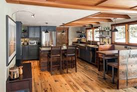 Log Cabin Home Kitchen With Gray Cabinets Custom Wood Island Wood Dining Nook And Wood Beams Log Cabin Kitchens Kitchen Remodel Design Kitchen Cabinet Design