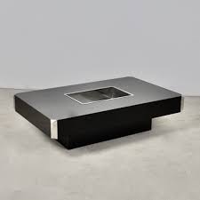 His originality is the alliance of the whitewashed oak worked for the exterior and of brass inserts in verdigris, with the personal shapes of the willy rizzo lines. Coffee Table By Willy Rizzo For Mario Sabot 1970s 167933