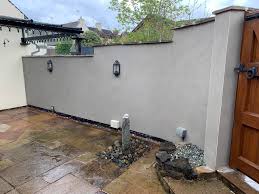 At the original blacksmiths in the village to removed the existing render ,  repointing of the coping stones