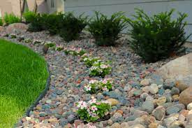 Sunken Pots Inside A Rock Bed For Easy Annual Color Change Throughout The Season By Maple Crest Landscape 2 Front Yard Landscaping Perennial Garden Love Garden