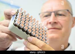 Dresden, Germany. 22nd June, 2022. Jens Albrecht, President of the Saxony  State Investigation Office for Health and Veterinary Affairs, holds samples  in the chemical drinking water laboratory. Alongside swine fever, the Corona