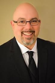 Orange band director returns to Johnstown