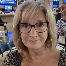 What resource summarizes the runniness of Mayco glazes?