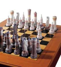Umbra's wobble chess set has a concave landscape which causes the chess pieces to wiggle and helps them stay in place when the board is moved. Lladro Porcelain Figurine Medieval Chess Set Sculpted By Juan Ignacio Aliena Medieval Chess Set Medieval Chess Chess Set
