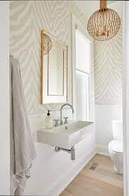 Then, changing your vanity countertop, faucet, and lighting fixture can help create the designer look you want. Light Airy And Updated Bathroom Boasts Gray Zebra Print Wallpaper And Shiplap Trim On Walls While Zebra Print Wallpaper Powder Room Wallpaper Half Bath Decor