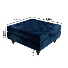 The rectangular velvet ottoman in blue lends an enticing flair to your living space. Grade A1 Inez Blue Velvet Ottoman Pouffe With Quilted Buttons Furniture123