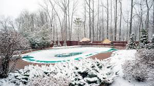 Bundled up, shivering and local pools frozen over: How To Winterize A Pool And What Can Happen If You Don T