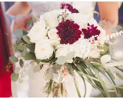 Cymbidium orchids, white mini callas and white roses. Bridal Bouquet Roses Dalia By Erica S Blooming Inspirations Milwaukee