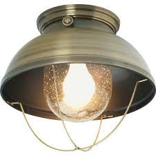 A bold plate accents the top of the structure as thin metal bars anchor the rustic light fixture to the ceiling. Cabela S Grand River Lodge Fisherman S Ceiling Light Cabela S Cabin Lighting Ceiling Lights Wall Ceiling Lights