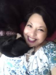 Bella and her moose laying