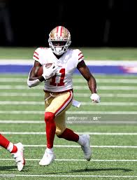 Brandon Aiyuk Of The San Francisco 49ers Carries The Ball In The In 2020 San Francisco 49ers 49ers San